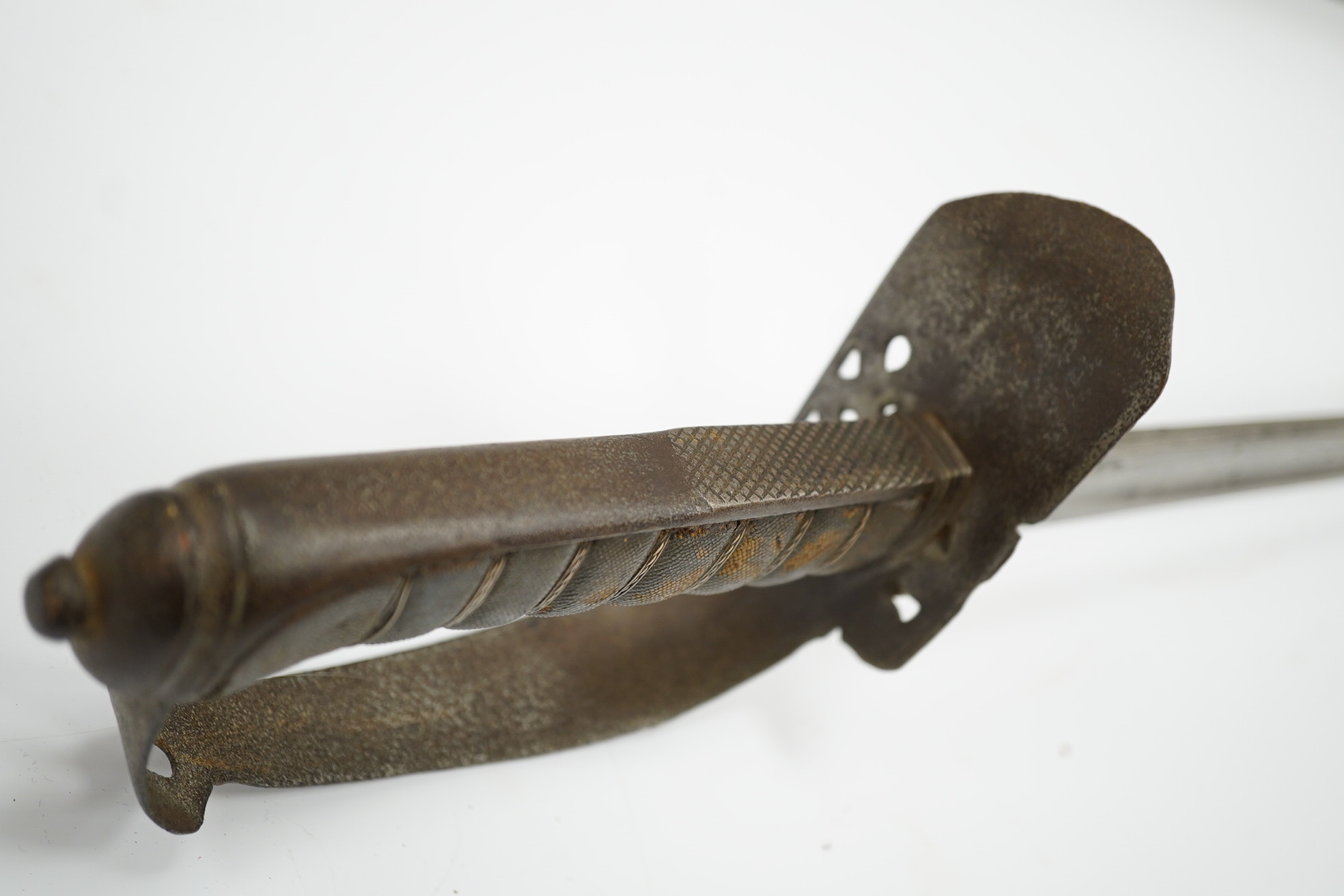 A mid-19th century British infantry sword, by Mole, Birmingham, marked I.S.D., in its leather scabbard with iron chape. Condition - poor, surface rust and knuckle guard significantly cut down.